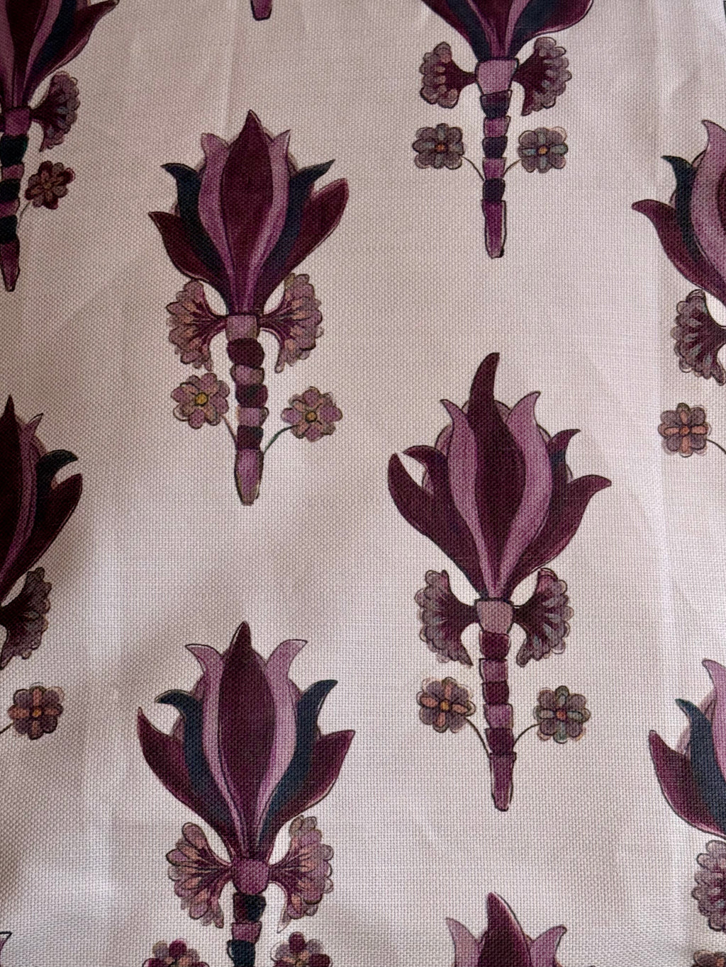 A yard ofAntiquity Fabric, Santa Maria with a floral pattern in purple and beige colors on a white background.