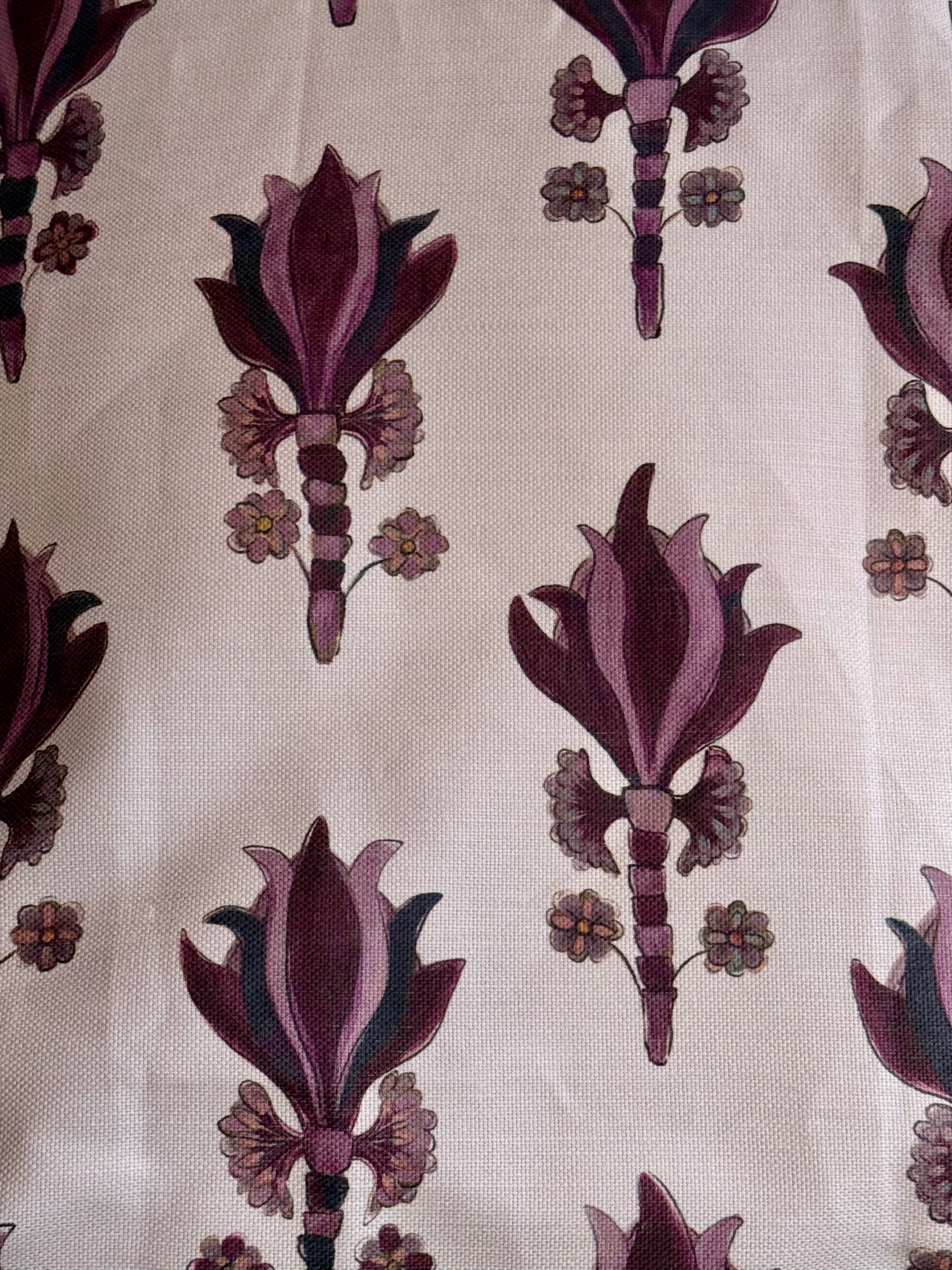 A yard ofAntiquity Fabric, Santa Maria with a floral pattern in purple and beige colors on a white background.