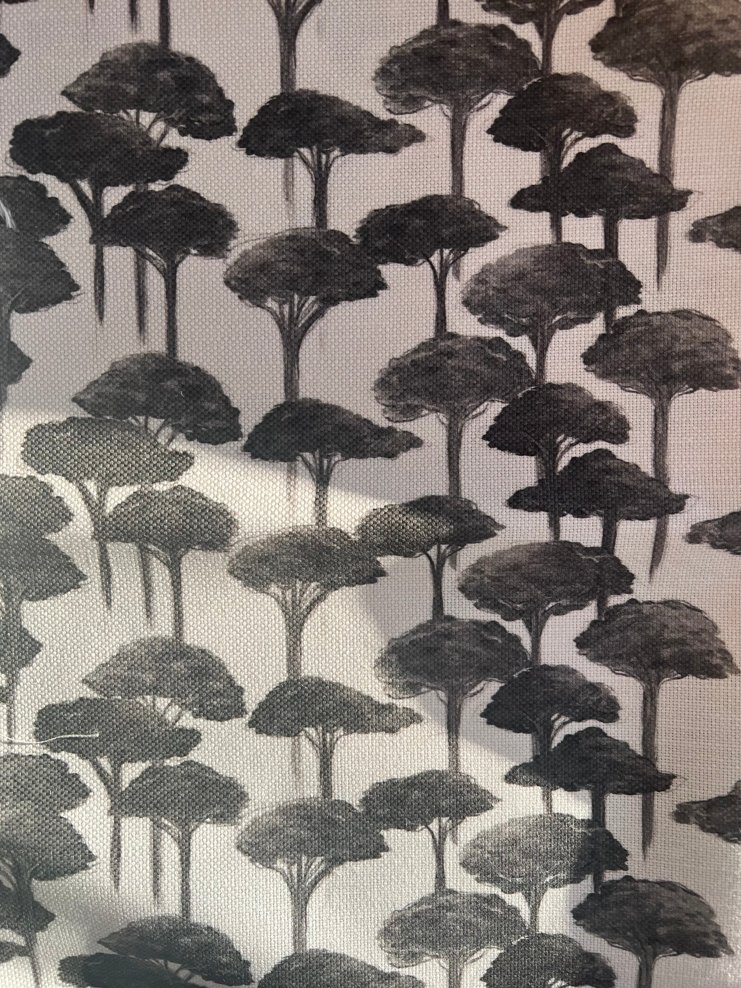 Fabric with a repeating pattern of pine trees in black on a white background.