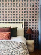 Sustainable wallpaper featuring bold Suzani hand-painted pattern