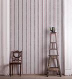 Sustainable grasscloth wallpaper featuring painterly stripes